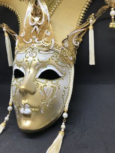 Venetian Mask for decoration - Traditional and original papier-mache Venetian mask, handmade and decorated with metal insert, gold-leaf and glitters,enriched with Swarovski crystals. dimensions::Hight 43cm,width 27cm Decorations only,Not wereable All our masks are handmade papier-machè masks made in Venice. Our decorators use techniques typical of the Venetian tradition such as stucco, acrylics, gold and silver-leaf, macramè, passementerie, glitters and crequelè to offer you a wide range of orig Venetian Masks For Mardi Gras Carnival, Venetian Masks For Mardi Gras, Venetian Masks For Mardi Gras Gift, Venetian Masks And Prosthetics For Carnival, Venetian Masks For Carnival Themed Events, Venetian Masks For Themed Carnival Events, Venetian Mask For Mardi Gras Costume, Venetian Masks And Prosthetics For Mardi Gras, Gold Venetian Mask For Halloween