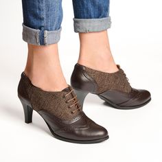 Crafted from dark brown leather with canvas accents, these oxfords offer a unique twist on a classic style. The kitten heel provides a subtle lift while ensuring all-day wearability, perfect for both professional and casual settings. Featuring rounded almond toes for a sleek and elegant look, and adorned with delicate brogue detailing, these oxfords exude timeless charm and refinement.  PRODUCT INFO: Premium leather upper and canvas Ultra smooth nappa leather lining Non-slip recycled rubber outs Retro Brown Leather Lace-up Shoes, Brown Leather Oxford Shoes With Rubber Heel Cap, Brown Oxford Leather Shoes With Rubber Heel Cap, Brown Pointed Toe Court Shoes With Leather Sole, Brown Lace-up Shoes With Brogue Detailing, Brown Almond Toe Lace-up Shoes With Brogue Detailing, Brown Brogue Lace-up Shoes For Office, Elegant Brown High Heel Lace-up Shoes, Fitted Leather Sole Oxfords For Fall