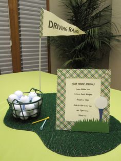 a green table with a basket of golf balls and a driving name sign on it