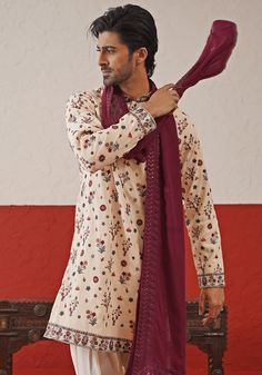 Explore the vibrancy of Cream Kurta. Crafted from pure georgette, the kurta features multi-color resham thread, sequin work, intricate embroidery on the collar and cuffs, and two practical pockets. Paired with ivory patiyala pants and wine color dupatta for sophisticated styling. Perfect for special occasions like Sangeet, Mehendi, Haldi, or as a wedding guest outfit. Composition : Kurta, Patiyala & Dupatta : Viscose Georgette Care: Dry Clean Only and Vacuum Storage This product can be customize Transitional Silk Kurta With Embroidered Border, Chanderi Sherwani With Long Sleeves And Floral Embroidery, Designer Sherwani With Embroidered Border And Traditional Drape, Designer Chanderi Sherwani With Embroidered Border, Long Sleeve Chanderi Sherwani With Embroidered Border, Multicolor Silk Kurta For Transitional Season, Transitional Multicolor Silk Kurta, Transitional Season Multicolor Silk Kurta, Traditional Drape Cotton Silk Kurta With Multicolor Embroidery