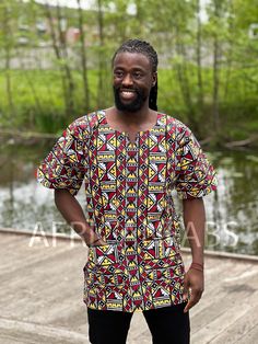 This beautiful dashiki dress / shirt can be worn by both men and women. It may be paired with jeans, leggings or a waist belt to make it more defined. For some, it can also be worn as a mini dress. This dress / shirt is perfect for any occasion. This shirt should traditionally be worn oversized. Short Sleeve Shirt Made of 100% Cotton 2 Front pockets Handwash recommended if possible or machine wash inside out at maximum 40 degrees celcius. (Please note: Every dashiki shirt is unique, because they Dashiki Shirt, Dashiki Dress, African Print Tops, Tee Dress, Mens Shirt Dress, Print Tops, Shirt Price, African Print, Short Sleeve Shirt