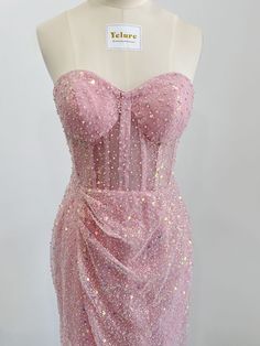 This fairytale yet stylish homecoming dress will make you stand out at your homecoming parties. the pink sequin tulle is decorated with pearls all over the dress, showing off a luxurious and airly dream look. 

Sequin Tulle

Sweetheart

Bones

Sheath

With Padding Homecoming Dresses With Sequins And Glitter Tulle, Pink Sequin Evening Dress For Party Season, Fitted Glitter Tulle Evening Dress, Pink Tulle Evening Dress For Party, Fitted Glitter Tulle Bridesmaid Dress, Pink Sparkling Evening Dress For Prom Season, Pink Sparkling Evening Dress For Prom, Glamorous Fitted Sequin Tulle Dress, Sparkling Pink Evening Dress For Prom Season