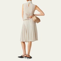 Miu Miu polka-dot crepe de chine skirt  High rise Hem falls below the knee Finished with pleating Invisible side zip Silk Made in Italy Silk Skirt With Accordion Pleats For Work, Silk Accordion Pleats Skirt For Work, Silk Skirt With Pleated Waist For Work, Silk Workwear Skirt With Pleated Waist, Elegant Polka Dot Midi Skirt, Pleated Midi Skirt, Miu Miu, The Knee, Side Zip