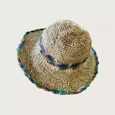 Hemp Crochet Sun Hat - Rainbow Our 100% handmade crocheted sun hats are made from pure hemp yarn from Nepal. Perfect for summer...at the beach, pool, festival or just hanging around. They come in one size which fits most! As with many 100% hemp products they maybe slightly stiff, but soften and stretch over time. Features: 100% Hemp hat and handmade in Nepal It has wire in the rim means you can shape the hat however you desire and flat pack it for easy storage or travel. One size which fit most Bohemian Lightweight Brimmed Hat, Bohemian Brimmed Lightweight Hat, Bohemian Adjustable Crochet Hat With Crochet Trim, Adjustable Bohemian Crochet Hat With Crochet Trim, Curved Brim Crochet Cotton Hat For Vacation, Curved Brim Crochet Hat In Cotton Yarn For Vacation, Adjustable Cotton Yarn Crochet Hat For Vacation, Wide Brim Cotton Yarn Crochet Hat For Vacation, Bohemian Lightweight Beige Crochet Hat