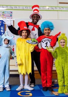 children in dr seuss costumes posing for the camera