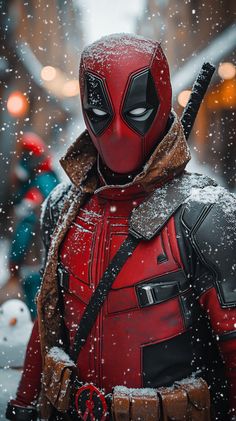 deadpool is standing in the snow with his back to the camera, wearing a red and black costume