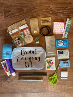 the contents of a bridal emergency kit laid out on top of a wooden table