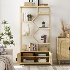 Handcrafted from natural rattan, this bookshelf combines beauty and function. The rattan's moisture-absorbing properties ensure both a comfortable atmosphere and a visually stunning effect. Featuring a multi-tiered storage design, it includes 1 natural rattan cabinet and 7 open display shelves to showcase your favorite items. The adjustable middle shelf provides flexibility for storing items of varying heights, while the adjustable foot pads keep the cabinet stable, even on uneven floors. Perfec Rattan Bookshelf, Farmhouse Bookcases, Farmhouse Bookshelf, Guest Bedroom Home Office, Bookshelf Office, Rattan Cabinet, Office Boho, Frames Decor, Organizing Books