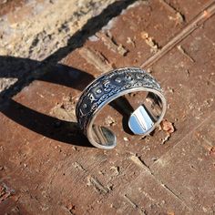 "This is a new style adjustable sterling silver ring features Buddhist Prayer \"Om Mani Padme Hum\" in Tibetan characters on the outside. The embossed Powerful Six Symbols in Tibetan Buddhism are: 唵（om）、嘛（ma）、呢（ni）、叭（pad）、咪（me）、吽（hum）. This simply elegant Buddhist Prayers Ring reminds us the key philosophy of Buddhism - All is Void. Humans often get loss in life while putting too much effort on judging others or complaining the surroundings, without realizing the world is just the reflection of Buddhist Prayers, Prayer Ring, Buddhist Symbols, Buddhist Prayer, Om Mani Padme Hum, Chinese Symbols, Meditation Rings, Ring Mens, Tibetan Buddhism