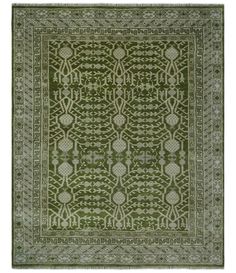 a green rug with an intricate design on it