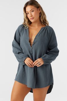 A flowy cover-up dress that has a relaxed long sleeve design and mini length fit. O'Neill Women's woven cover-up 28" In length Front button closure Solid color wash Lightweight, breathable fabrication 100% Cotton Crinkle Double Gauze Chic Long Sleeve Cover-up For Daywear, Chic Long Sleeve Loungewear Cover-up, Long Sleeve Beachwear Cover-up For Loungewear, Relaxed Fit Long Sleeve Cover-up For Vacation, Long Sleeve Mini Dress For Brunch During Beach Season, Long Sleeve Beachwear Tops For Vacation, Long Sleeve Blouse For Summer Beachwear, Summer Long Sleeve Oversized Cover-up, Long Sleeve Cotton Dress For Beach Season