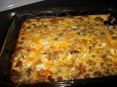 a casserole dish with meat and cheese in it on a stove top oven