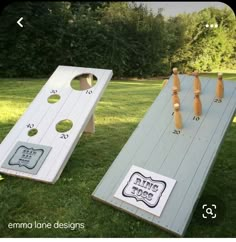 two corno game boards sitting in the grass