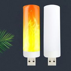 two white and yellow lights next to each other on a black background with palm leaves