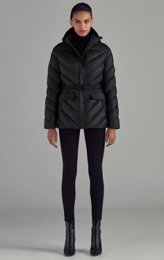 The Montalva is a short women's puffer that features an elastic belt with metallic closure and contrast quilting on the front and rear of the coat. Belted Puffer Jacket Outfit, Luxury Quilted Jacket For Work, Luxury Quilted Puffer Jacket For Cold Weather, Luxury Women's Puffer Jacket With Pockets, Black Down Puffer Jacket With Pockets, Luxury Puffer Jacket With Pockets, Puffer Jacket With Belt, Luxury Black Quilted Puffer Jacket, Black Functional Puffer Jacket With Padded Collar