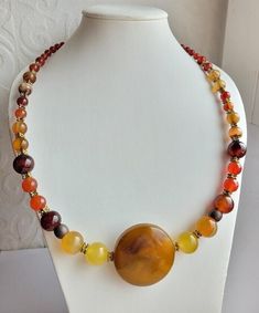 This necklace is made of round carnelian beads is such a dold and stunning necklace on, with edgy artisan appeal. In the center of the necklace is a large flat bead 1 cm high. This necklace can be worn by stylish men and women.      Such a dold statement maker, unique and very artisan. So stunning on, ful of vibrant light and color, reflection, this is day every day necklace yoif looking for - with jeans and a blouse, or dressed up, it goes with everything, enjoy.       Carnelian is known to stimulate creativity and restore motivation. Romans believed that carnelian a stone for courage and confidence. According to astrologers, Carnelian is suitable for all signs of the zodiac, except for Scorpio.       If you want to give a gift to a loved one, I will provide gift wrapping. Please do not d Perle Plate, Every Day Necklace, Necklace Birthstone, Beaded Jewelry Designs, Carnelian Beads, Bib Necklaces, Stunning Necklace, Handmade Boho, Beads Necklace