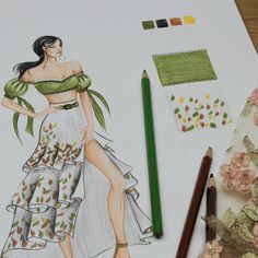 a drawing of a woman in a dress next to some flowers and crayon pencils