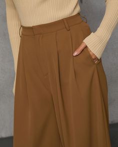 Trendy babes will love the Madrigal Pocketed Wide Leg Pants that goes with everything and features a relaxed, wide leg fit. It's an elevated and versatile basic that belongs at the center of your capsule wardrobe. High rise Wide pant leg Pocketed Front zip fly and hook closure Not lined 100% Polyester Sleeveless Cardigan, Swimwear Bottoms, Wrap Sweater, Wide Pants, New Tops, Long Sweaters, Hat Hairstyles, Western Wear, Sweater Accessories