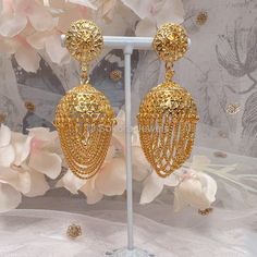 Medium jhumka style earrings in bright gold finish with chain tassels Earring drop length 2.5 inch, width 1.5 inches and light weight to wear Ready to ship As Seen with Gift Packaging. Gold Jhumkas, Stacked Bangles, Pierced Jewelry, Bright Gold, Style Earrings, Tassel Earrings, Gift Packaging, Hair Pieces, Gold Finish