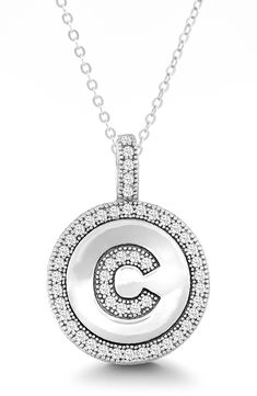 Micro pavé cubic zirconia stones create initial details on this giftable sterling silver pendant necklace. 18" chain length with 1" extension, 0.5" pendant length Sterling silver/cubic zirconia Imported Silver Cubic Zirconia Initial Necklace For Gift, Silver Cubic Zirconia Initial Necklace, Personalized Silver Initial Necklace With Cubic Zirconia, Silver Initial Necklace With Diamond Accents For Anniversary, Classic Silver Initial Necklace With Diamond Accents, Initials Cubic Zirconia Round Necklace, Round Cubic Zirconia Initial Necklaces, Personalized Silver Cubic Zirconia Charm Necklaces, Cubic Zirconia Initials Necklace