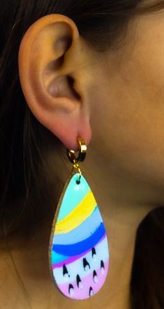 These handpainted earrings are the perfect statement piece - an artful combination of brush strokes that make a statement. Put 'em on, and you'll be the talk of the town! Seriously though, these earrings will bring out your inner artist with a look that's uniquely yours. These multi-color beauties shimmer and shine with a resin finish and iridescent details. Plus, the gold accents and gold finished hardware add a luxe touch. Colors will vary on different screens. Most appear brighter in person. Hand Painted Yellow Artsy Earrings, Yellow Hand Painted Artsy Earrings, Colorful Hand-painted Drop Earrings, Colorful Hand Painted Drop Earrings, Artistic Hand Painted Drop Earrings, Artsy Hand Painted Colorful Earrings, Hand Painted Earrings, Painted Earrings, Shimmer N Shine