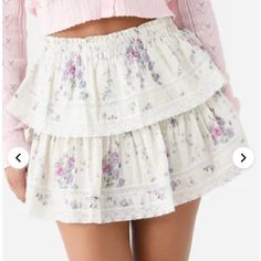 Brand New With Tags, Never Worn Smocked Waistband Tiered Silhouette Inset Lace Details All-Over Novelty Print 100% Cotton Slim Fit Model Is Wearing Size Small Skirt. Model's Measurements: Height: 5'9" | Bust: 32b | Waist: 24" | Hips: 36" | Dress Size: 2 (Us) Feminine White Skirt With Ruffle Hem, Feminine Lace Trim Bottoms For Brunch, White Tiered Bottoms For Spring, Casual Tiered Bottoms With Lace Trim, White Ruffled Skirt In Cottagecore Style, White Tiered Skirt With Floral Print, White Feminine Skirt With Elastic Waistband, Cottagecore White Skirt For Spring, White Cottagecore Skirt For Spring