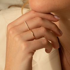 Meet the perfect dainty diamond band ring - the Pavé Diamond Ring. Studded in tiny diamonds, its classic design and dainty size make it the perfect everyday ring. It’s lightweight and solid gold, so it’s sure to give you a confidence boost and a little sparkle as you take on your day. Make it yours and treasure this classic forever! DETAILS 14k solid gold ring 24 lab-grown diamonds Diamond carat: 0.01 ct Diamond color & clarity: DEF-SI Available in sizes 5-8 Weight: 0.63g Safe for sensitive skin Single Rings Simple, Dainty Silver Jewelry Rings, Gold Ring Dainty, Minimal Ring Design, Gold Rings Dainty, Simple Gold Rings Everyday, Everyday Ring Stack, Rings Gold Simple, Minimal Rings Minimalist Jewelry