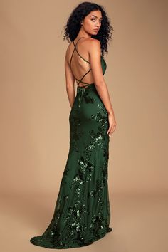 Make it a night to remember in the Lulus Valhalla Forest Green Sequin Lace-Up Maxi Dress! Sheer mesh, embellished with an eye-catching display of shiny forest green sequins, covers this gorgeous gown with a V-neckline and triangle bodice with seamed, lightly padded cups. High, empire waist flows into a figure-flaunting mermaid maxi skirt, with a slight high-low hem. Adjustable satin straps create a sultry lace-up look atop the open back, for a headturning finish. Hidden back zipper/clasp. Fit: T Green Sequin Prom Dress, Forest Green Dresses, Green Formal Dresses, Sequin Prom Dress, Prom Dress Inspiration, Formal Dresses Gowns, Cute Prom Dresses, Pretty Prom Dresses, Sequin Maxi Dress