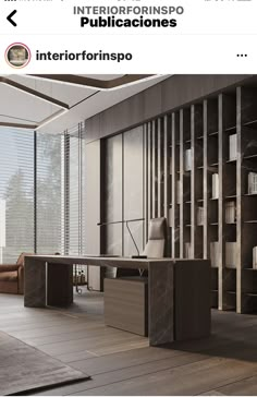 an office with a bookcase and desk in the middle, along with a large window