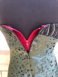 Vintage 1980's Geoffrey Beene strapless mini dress. In the softest dark emerald green silk velvet! Jet black beading at the bodice sides and metallic dots throughout. Boning at the bust. Zippered back and zippered lining. Excellent vintage condition. No sign of wear! Dress was too tight on the dress form to completely zip the back. label: Geoffrey Beene fabric: silk velvet size: not listed. Please check measurements for an accurate fit. Questions are welcome! Dress was measured flat across the f Green Velvet Strapless Dress, Vintage Embellished Green Dresses, Embossed Velvet Dress, Retro Green Velvet Dress, 1940s Velvet Dress, Geoffrey Beene, Black Leather Backpack, Vintage Velvet, Dress Form