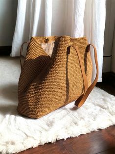 Any woman must have this bag for every fashionista. Whether you keeping it to yourself or gifting someone you care, it will be unforgettable. ✔️I made this beautiful bag from natural paper rope which is organic cotton and genuine leather in tan. ✔️The interior of the straw summer bag is fully lined with cotton and has a magnetic button. Suitable for use as shoulder bag, beach bag, travel bag or party bag. ✔️The bag has cotton lining. A lining of the appropriate color is sewn into the crochet pap Chic Travel Straw Pouch Bag, Natural Pouch Shoulder Bag For Vacation, Natural Color Pouch Shoulder Bag For Vacation, Vacation Crochet Pouch Bag With Adjustable Strap, Adjustable Strap Crochet Pouch Bag For Vacation, Natural Pouch Bucket Bag For Vacation, Woven Bucket Bag For Travel, Summer Straw Pouch Bag For Everyday Use, Travel Jute Bucket Shoulder Bag