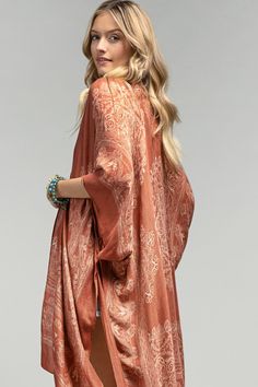 Semi-sheer woven kimono features an ornate mandala print with lotus pattern border*100% Viscose*APPROX. W 40" L 36" Bohemian Patterned Open Front Kimono, Flowy Boho Print Kimono For Fall, Bohemian Open Front Patterned Kimono, Fall Boho Print Flowy Kimono, Fall Boho Print Open Front Kimono, Bohemian Beach Cover-up With Kimono Sleeves, Bohemian Outerwear With Kimono Sleeves For Beach, Bohemian Festival Cardigan With Kimono Sleeves, Bohemian Cardigan With Kimono Sleeves For Festivals