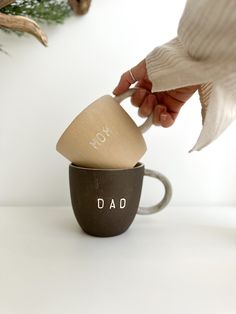 These handmade Mugs make the perfect gift to personalize for any couple! Crafted with love, you can choose from a variety of colors to make these ceramic mugs totally unique. Perfect for celebrating a birth announcement ☺️ Listing price is per mug or for pair MEASURES :approx. 4" wide x 4" tall - Holds approximately 16oz Why You’ll Love It Dishwasher & Microwave safe Beautiful Exterior Clay Finish Glossy white interior + handle finish Sustainably handmade in NC, USA Created just for you ! How special is that?! This item is MADE TO ORDER➕ Please allow 4 weeks for me to create this just for you! This item is 100% handmade just for you, expect slight variations in texture, dimensions and color. Your piece will be even more beautiful in person with its own uniqueness Handmade Ceramic Mugs, Beautiful Exterior, Handmade Mugs, Dad Mug, Mom Mug, Christmas Delivery, Apple Pay, White Interior, Glossy White