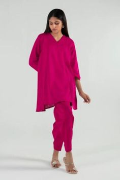 Introducing our stunning and chic two-piece kurta and pants set - a must-have addition to your wardrobe. Made from high-quality fabric, this set is designed for both comfort and style. The kurta features delicate details that add a touch of elegance to your look. The length of the kurta is just right, hitting just above the knees for a modern and sophisticated look.  The pants are designed in a straight leg style, featuring a comfortable and adjustable waistband for a perfect fit. The length is just right to complement the kurta, creating a cohesive and stylish outfit. Whether you're attending a wedding, Eid celebration, or simply want to elevate your everyday look, this set is perfect for any occasion. Pair it with your favorite accessories, shoes, and bag to create a complete look that w Pink Tunic Sets For Eid, Designer Tunic Sets With Dabka Work, Eid Dabka Palazzo Set With Tunic, Traditional Pink Tunic Sets, Pink Straight Kurta Pant Set For Designer Wear, Pink Bollywood Pant Set With Chikankari Embroidery, Unstitched Pant Set With Dabka Work For Diwali, Pink Pant Set With Dabka Work For Diwali, Bollywood Style Pink Pant Set With Dabka Work