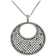 This spectacular pendant necklace features 140 round brilliant cut diamonds set in beautifully detailed 18K white gold.  Approximate total diamond weight:  1.50 ct.  Diamond color: H-I  Diamond clarity: SI1  Size:  16.5 inches (necklace)  48 mm x 39 mm (pendant)  Weight:  9.7 dwt. /  15.2 gr.  Stamped: 3142  AL  750  Very good condition, professionally polished.  Will come packaged in a gift box or pouch (when possible) and will be shipped U.S. Priority Mail Insured. Luxury Round Pendant Cubic Zirconia Diamond Necklace, Luxury Cubic Zirconia Diamond Necklace With Round Pendant, Silver Diamond Necklace With 17 Jewels, Silver Pendant Diamond Necklace With Rose Cut Diamonds, Silver Rose Cut Diamond Pendant Necklace, Silver Diamond Pendant Necklace With Rose Cut, Silver Diamond Necklace With Rose Cut Pendant, Sterling Silver Round Diamond Necklace With Rose Cut Diamonds, Sterling Silver Diamond Necklace With Rose Cut Diamonds