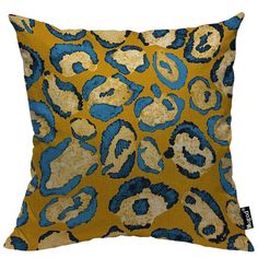 a yellow and blue leopard print pillow on a white background