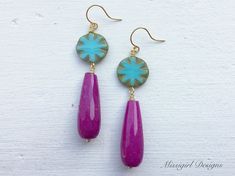 These beautiful statement earrings were created with 15mm Czech glass turquoise beads and 30x8mm purple jade teardrop beads. These stunning earrings dangle from gold plated ear wires and measure 2 1/2 inches in length. These stylish and chic earrings would be the perfect gift for you or someone special. All earrings will arrive to you in a gift box tied with a bow for easy gift giving and a small zipper baggie for storage. Earrings will also arrive with clear rubber backs to protect them from lo Bohemian Teardrop Earrings With Natural Stones, Bohemian Drop Gemstone Earrings, Purple Teardrop Bohemian Earrings, Bohemian Pink Teardrop Dangle Earrings, Handmade Pink Bohemian Teardrop Earrings, Bohemian Gemstone Teardrop Earrings For Gift, Bohemian Gemstone Teardrop Earrings, Pink Bohemian Teardrop Earrings, Bohemian Pink Teardrop Earrings