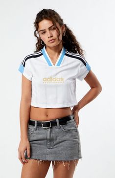 Elevate your casual style with the Tiro Cut 3-Stripes Cropped Jersey from adidas. Crafted from recycled materials, this sporty crop top brings a football-inspired flair to your everyday look. The soft doubleknit fabric and V-neck ribbed collar offer comfort and a nod to classic sport aesthetics. With its cropped cut and wide stripes, this jersey seamlessly transitions from daytime outings to evening events, effortlessly pairing with tights or jeans.Contrast 3-StripesShort sleevesV-necklineadidas graphicCropped length100% recycled polyesterMachine washableModel is wearing a size smallModel measurements: 5’5” height, 31” bust, 23” waist, 36” hipsLearn more about PacSun eco items adidas Womens Tiro Cut 3-Stripes Cropped Jersey - White size Small White Adidas Activewear For Streetwear, Adidas White Activewear With Three Stripes, White Three Stripes Activewear For Sports Season, White Three-stripes Activewear For Sports Season, White Adidas Activewear For Spring, Spring Adidas White Activewear, White Adidas Logo Top For Sports Season, White Adidas Logo Top For Sports, White Adidas Tops For Sports Season