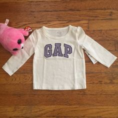 White Long-Sleeved Tee Shirt With Gap Logo In Lavender (Outlined In Purple). 100% Cotton. Playful Cotton Tops By Gap, Gap Logo, Long Sleeve Tee Shirts, Baby Gap, Shirt Color, Kids Shirts, New Baby, Color Purple, Shirts Tops