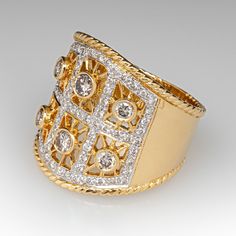 a gold and diamond ring on a white background