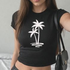 Step back into the beloved 90s era with our Classic 90s Style Women's Baby Tee, blending nostalgia with modern-day fashion. 90's baby tees were kids size shirt for women making it a belly shirt but not the crop top of the 80's.  Created for you with attention to detail and a deep commitment to your satisfaction. ✩ PRODUCT HIGHLIGHTS ✩ Enjoy the comfort of women's baby tee in solid colors made with extra lightweight, airlume-combed, ring spun cotton for the best comfort t-shirt. Ideal for precisi Casual Summer Tops With Graphic Design, Black 90s Style T-shirt For Summer, 90s Style Black T-shirt For Summer, Y2k Summer Tops With Screen Print, Y2k Style Screen Print Summer Tops, Y2k Style Screen Print Tops For Summer, Y2k Summer Screen Print Tops, Y2k Style Summer Tops With Screen Print, Y2k Short Sleeve Top With Front Print