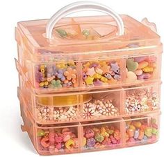 a plastic container filled with lots of different types of beads