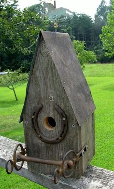 a birdhouse with a hole in the roof