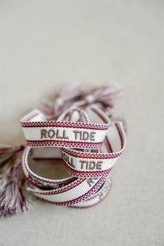 OFFICIALLY LICENSED BY THE UNIVERSITY OF ALABAMA This "Roll Tide" crimson and white bracelet is perfect in the friendship bracelet era! The bracelet has easy adjustable ties and fringe tassels. White Bohemian Personalized Friendship Bracelets, Personalized White Bohemian Friendship Bracelets, Bohemian White Personalized Friendship Bracelets, Adjustable White Bracelet Souvenir, White Band Jewelry Gift, Adjustable White Band Bracelet, The University Of Alabama, White Bracelet, Woven Bracelet