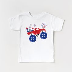 a red monster truck with blue wheels and fireworks on it's chest is shown in front of a white t - shirt