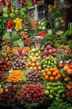 an assortment of fruits and vegetables on display