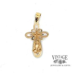 This exquisite 10 karat yellow gold cross pendant features a delicate lace design and embossed praying hands with one tiny diamond in center. 10 karat yellow gold lace design cross pendant with embossed praying hands Chain sold separately Stamped 14k Gold Spiritual Jewelry And Charms, 14k Stamped Crucifix Jewelry For Anniversary, 14k Gold Stamped Crucifix Jewelry For Anniversary, Yellow Gold Cross Necklace For First Communion, Yellow Gold Cross Necklace For Anniversary, Gold Cross Pendant With Intricate Design, Gold Filigree Cross Jewelry, Gold Cross Pendant Jewelry With Intricate Design, Yellow Gold Filigree Cross Jewelry