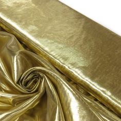 a close up view of a shiny gold cloth