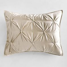 a white pillow with an intricate design on it