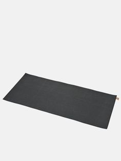 a black yoga mat on a white background